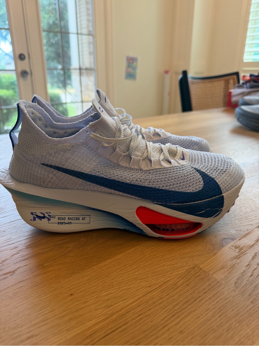 Nike Men’s White & Blue ZoomX Road Racing Shoes